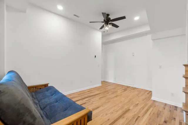 a living room with a bed and furniture