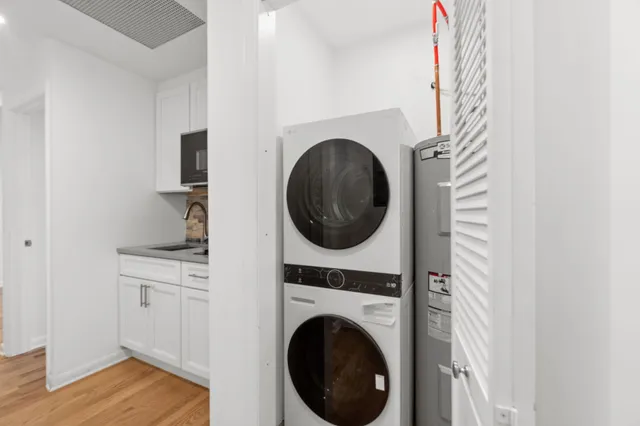 a view of a hallway with washer and dryer