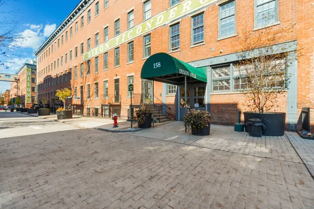 a view of a building with sitting area