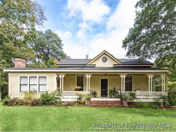 524 Carthage Street Cameron, NC 28326 - Photo 1 of 16 front view of a house with a yard