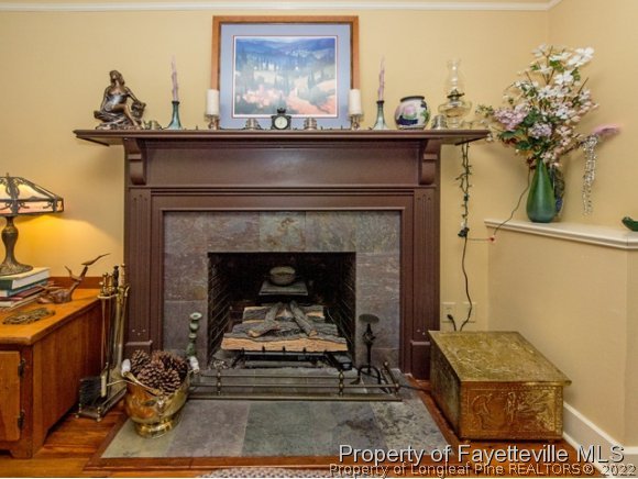 524 Carthage Street Cameron, NC 28326 - Photo 5 of 16 a living room with furniture and a fireplace
