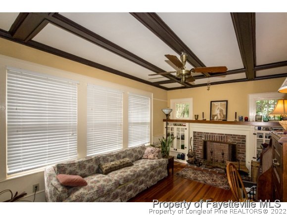 524 Carthage Street Cameron, NC 28326 - Photo 6 of 16 a living room with furniture and a fireplace