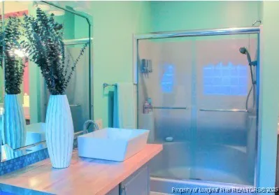 a bathroom with a bathtub and a shower