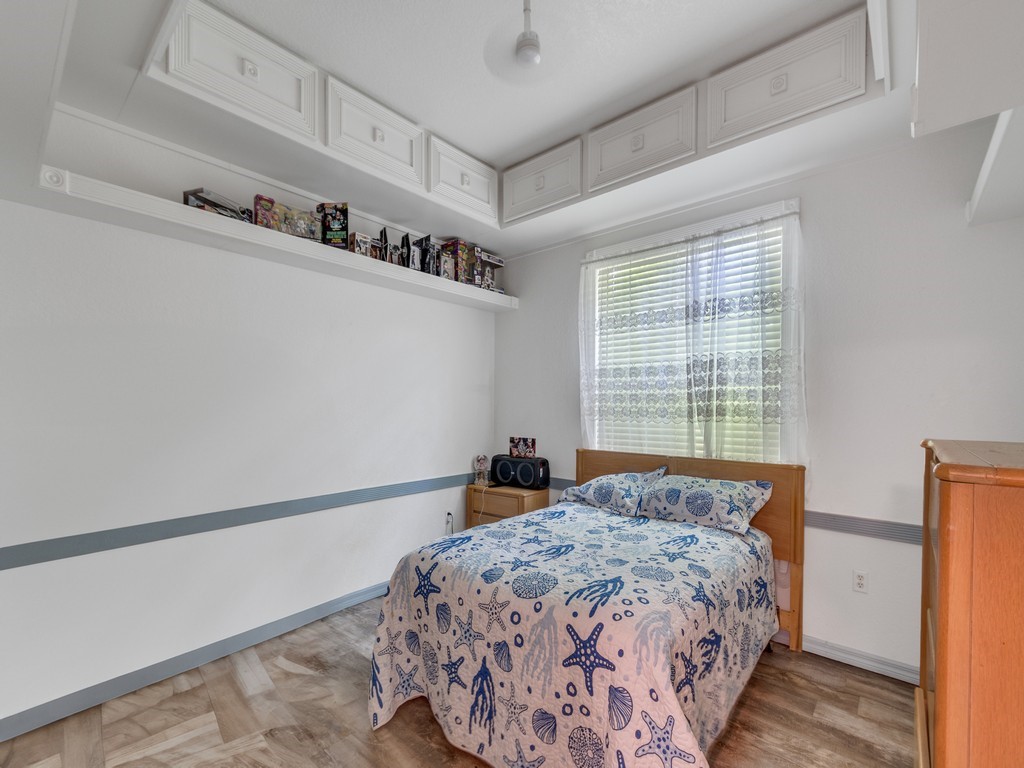 10615 Highway 1 Sebastian, FL 32958 - Photo 18 of 33 a bedroom with a bed and a window