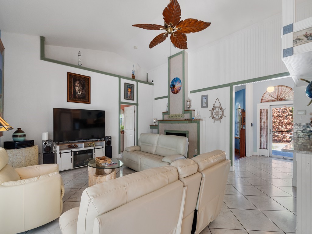 10615 Highway 1 Sebastian, FL 32958 - Photo 4 of 33 a living room with furniture and a flat screen tv