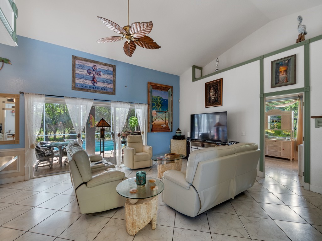 10615 Highway 1 Sebastian, FL 32958 - Photo 5 of 33 a living room with fireplace furniture and a large window
