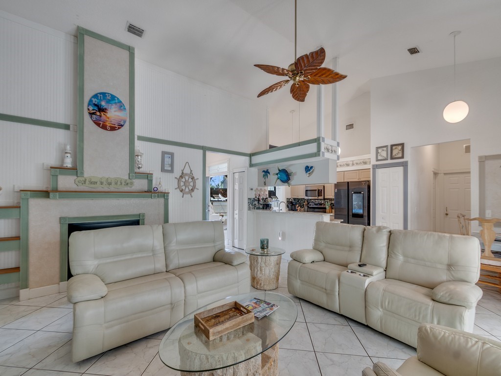 10615 Highway 1 Sebastian, FL 32958 - Photo 6 of 33 a living room with furniture and a chandelier
