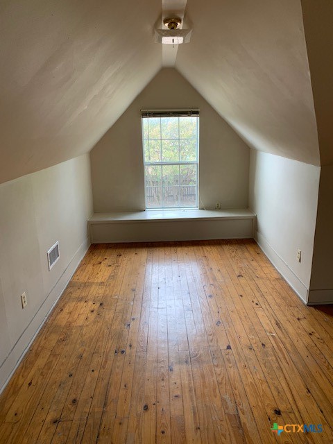 1205 Florence Road Killeen, TX 76541 - Photo 12 of 15 an empty room with wooden floor and windows