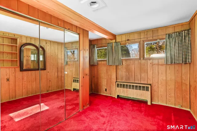 a view of wooden floor and windows in a room