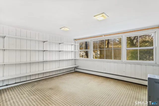 a view of a house with wooden fence