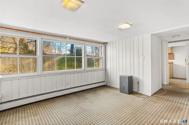 a view of an empty room with a window