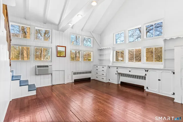 a view of a livingroom with furniture and wooden floor