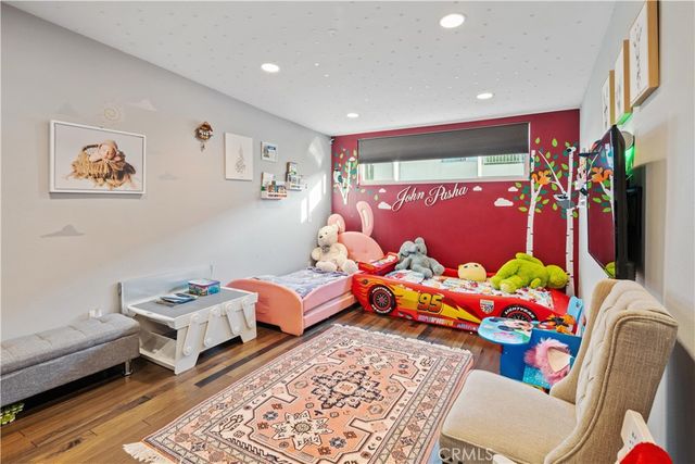 a bedroom with furniture and a bed