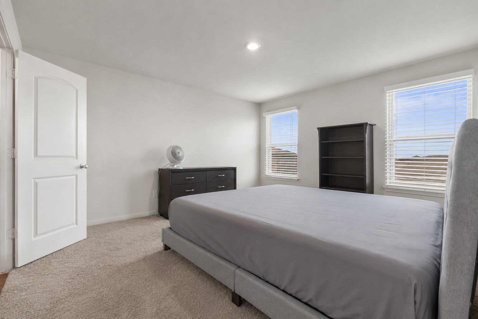 304 Hyacinth Way, Unit #7K Jarrell, TX 76537 - Photo 13 of 26 Well-lit sleeping quarters with broad windows providing ample natural illumination.