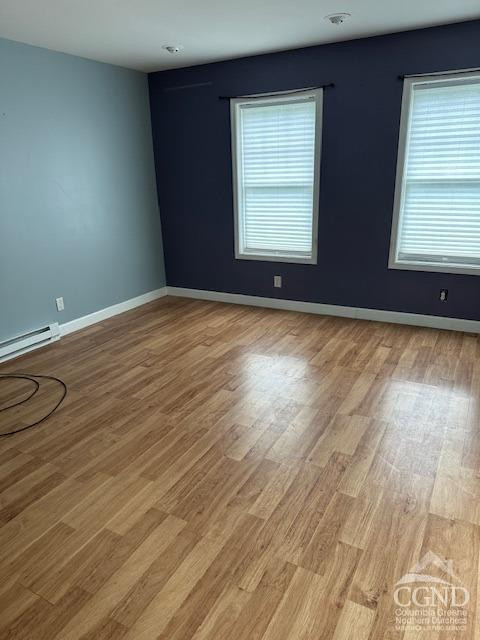 555 West Main Street Catskill, NY 12414 - Photo 4 of 14 an empty room with wooden floor and windows