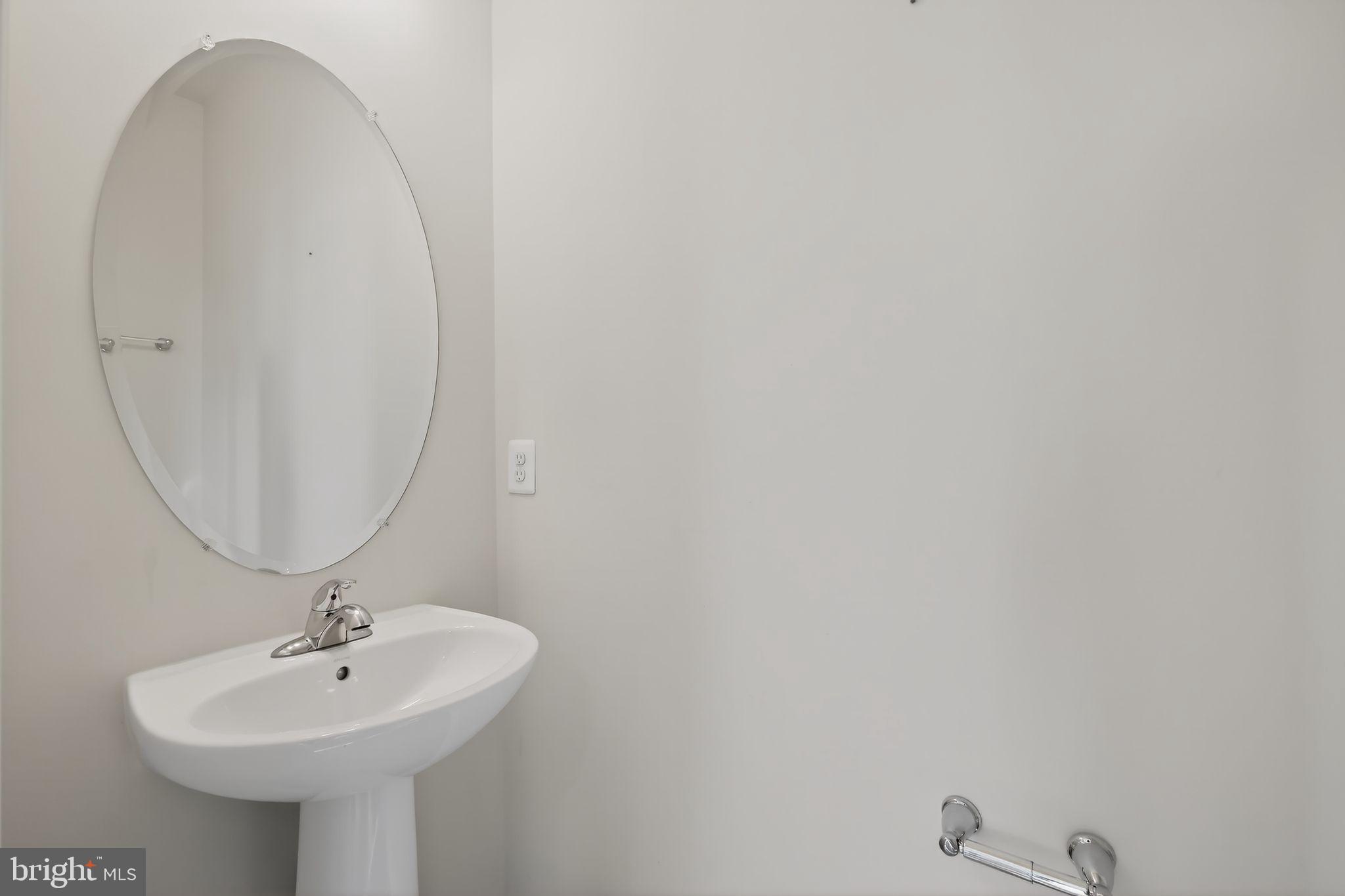 1518 Ricketts Road Frederick, MD 21702 - Photo 14 of 32 a bathroom with a sink and mirror