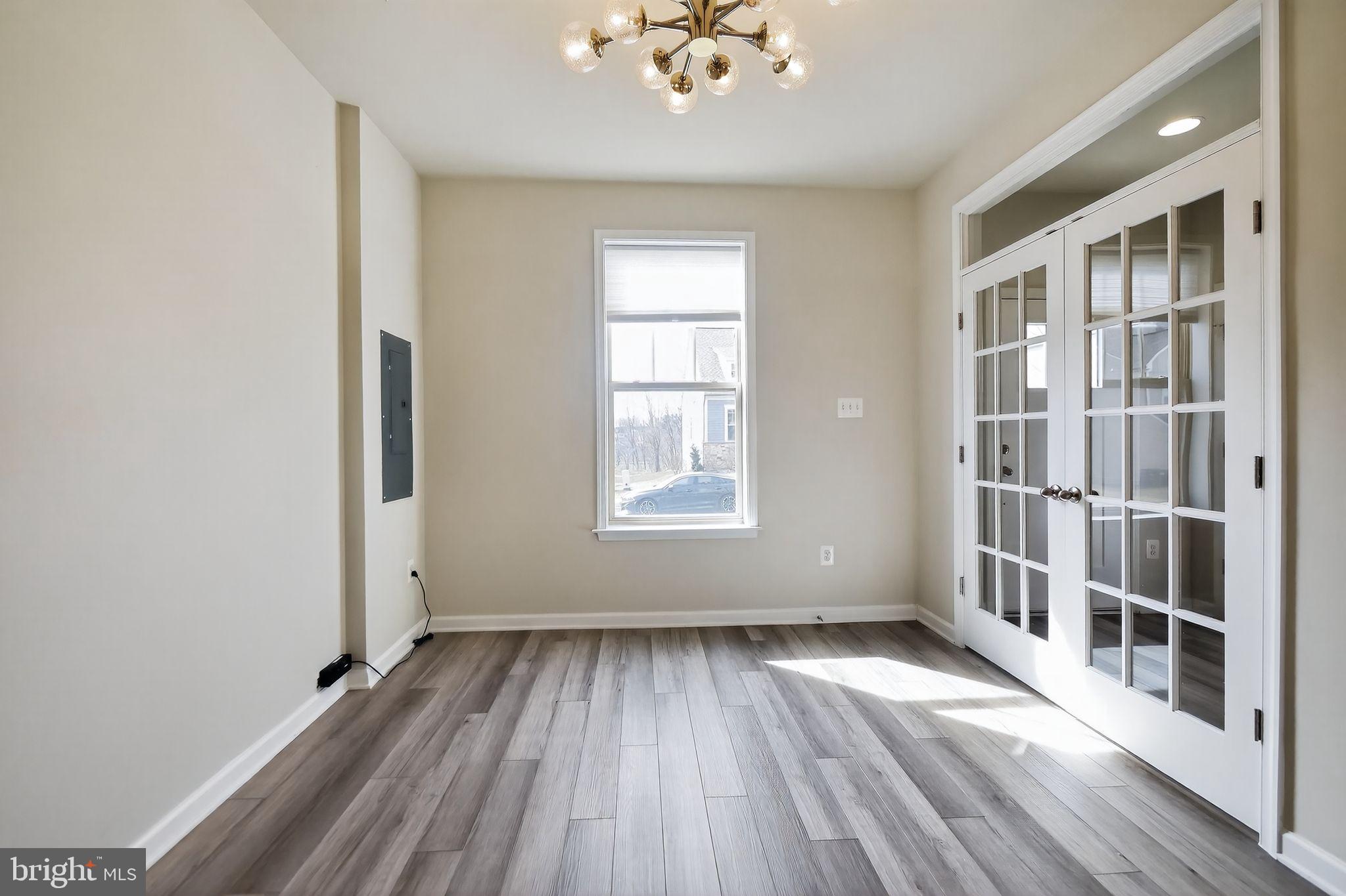 1518 Ricketts Road Frederick, MD 21702 - Photo 15 of 32 wooden floor in an empty room with a window