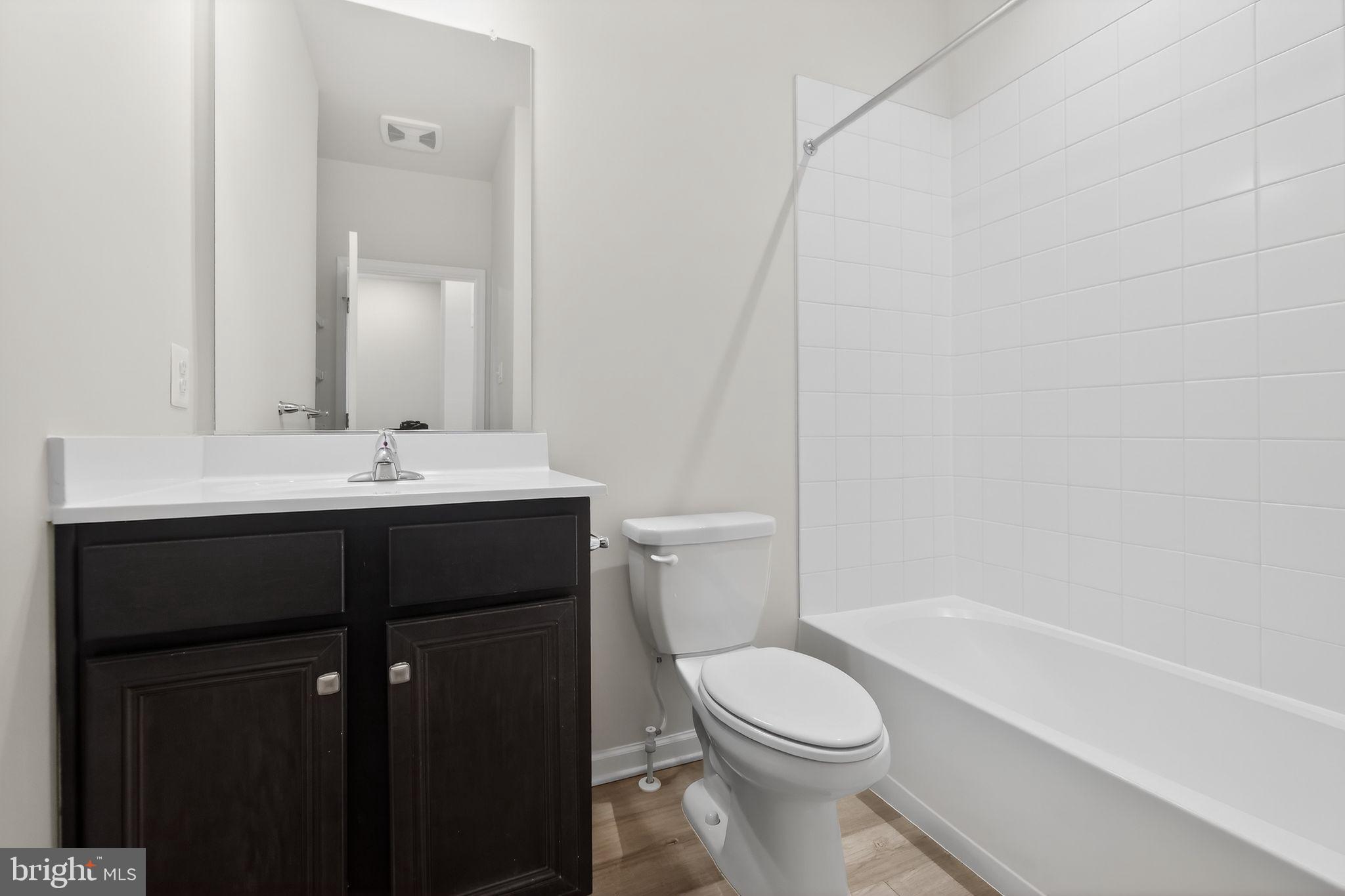 1518 Ricketts Road Frederick, MD 21702 - Photo 16 of 32 a bathroom with a sink a toilet and shower