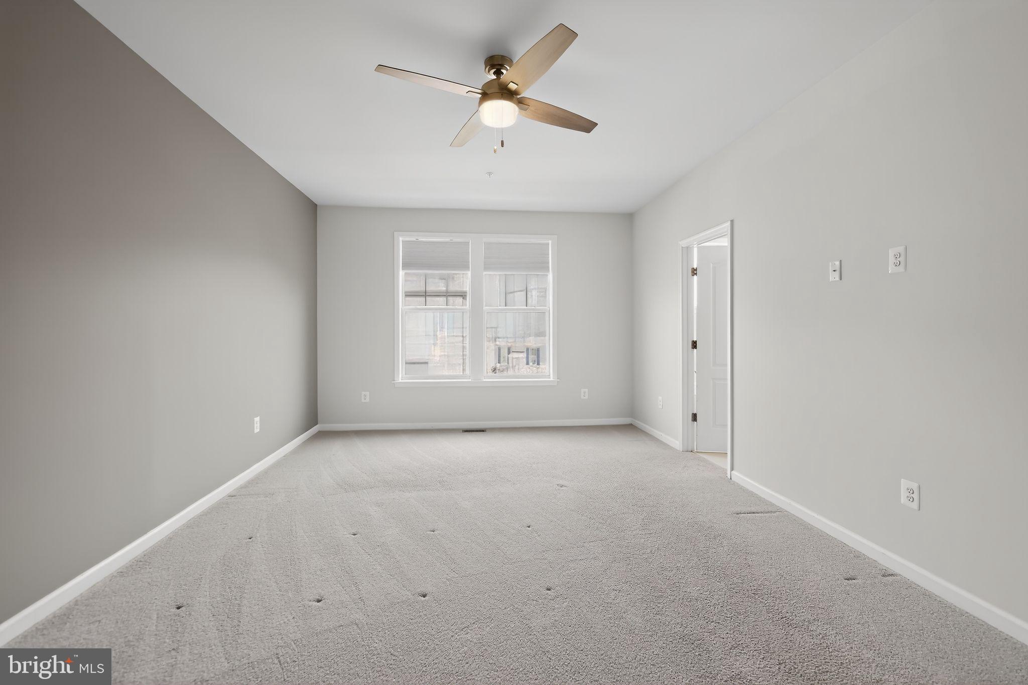 1518 Ricketts Road Frederick, MD 21702 - Photo 19 of 32 wooden floor in an empty room with a window
