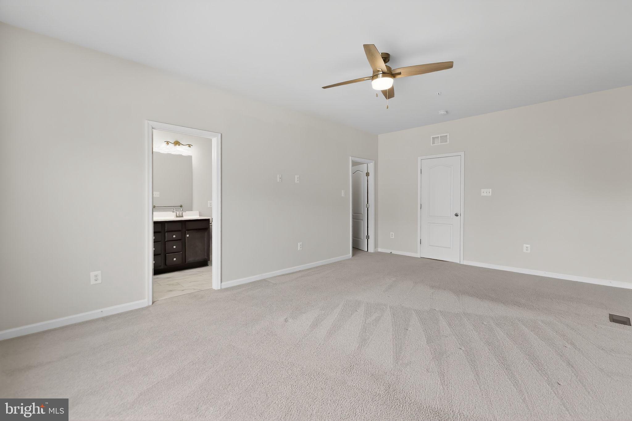 1518 Ricketts Road Frederick, MD 21702 - Photo 21 of 32 an empty room with closet and ceiling fan