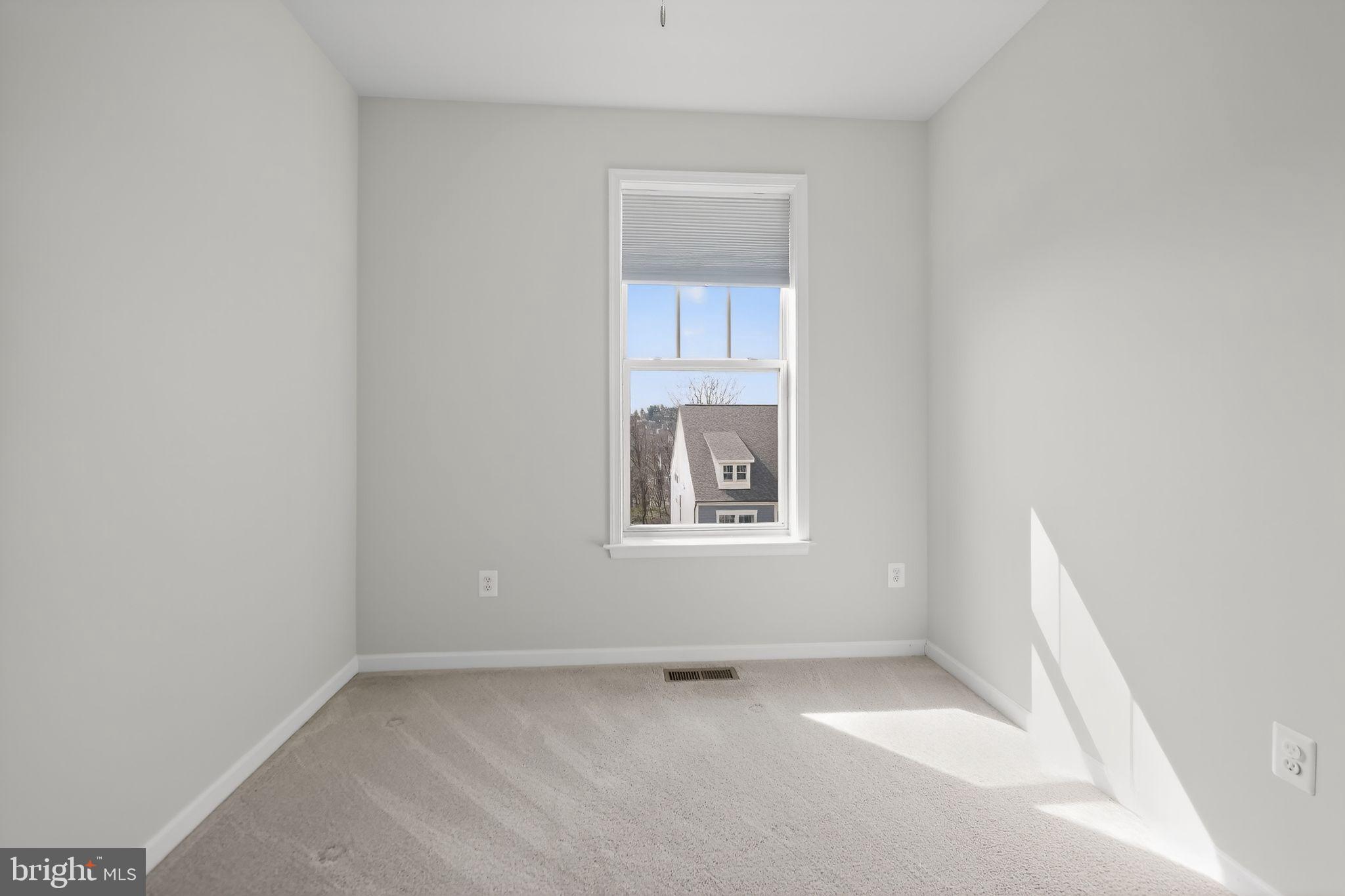 1518 Ricketts Road Frederick, MD 21702 - Photo 26 of 32 a view of an empty room with a window