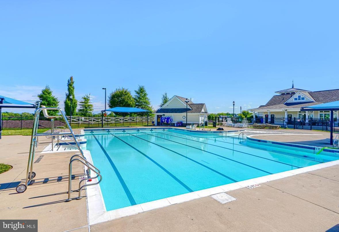 1518 Ricketts Road Frederick, MD 21702 - Photo 32 of 32 a view of swimming pool with outdoor seating and a garden