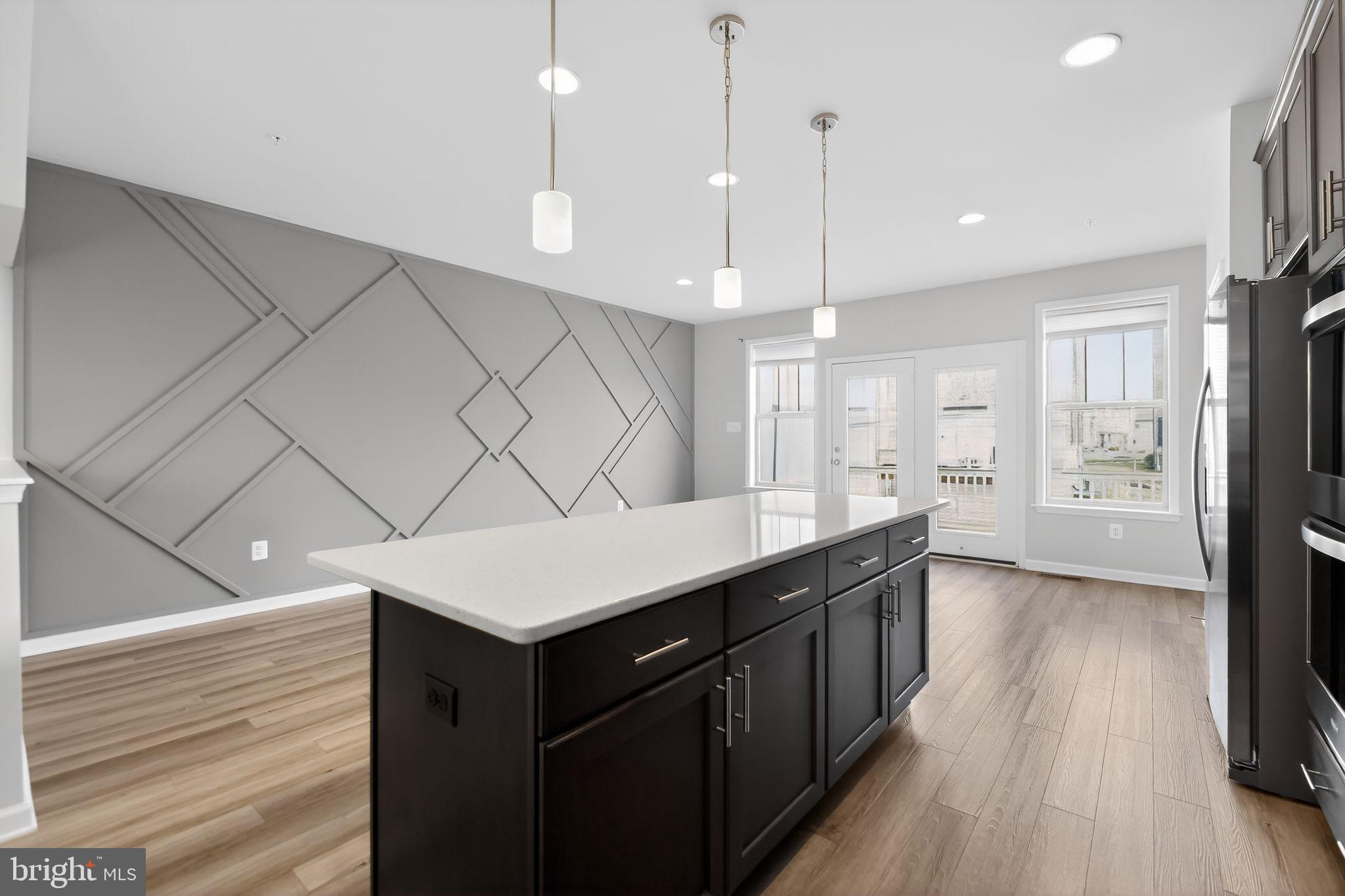 1518 Ricketts Road Frederick, MD 21702 - Photo 8 of 32 a kitchen with a sink a counter space and wooden floor