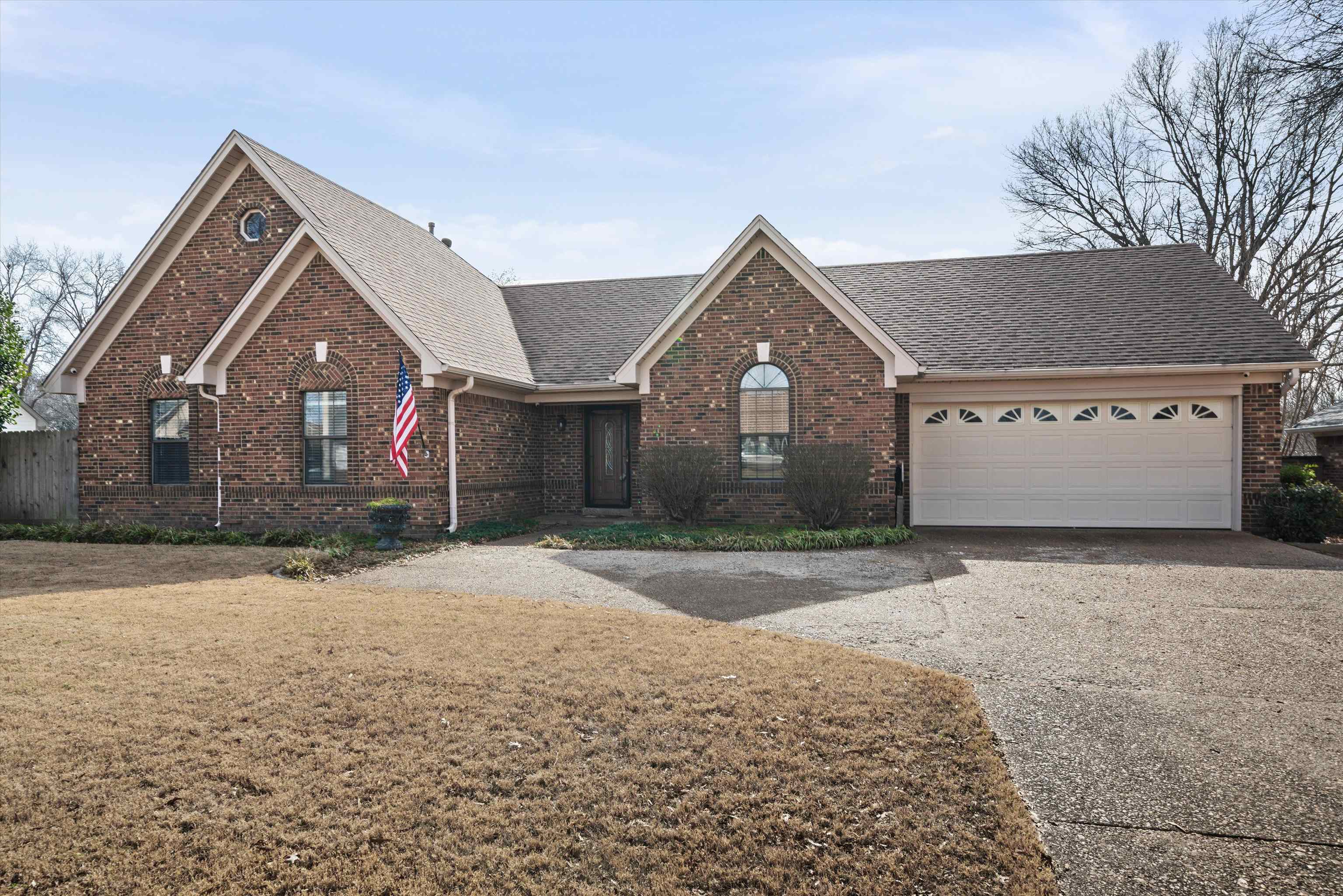 front view of a house with a yard