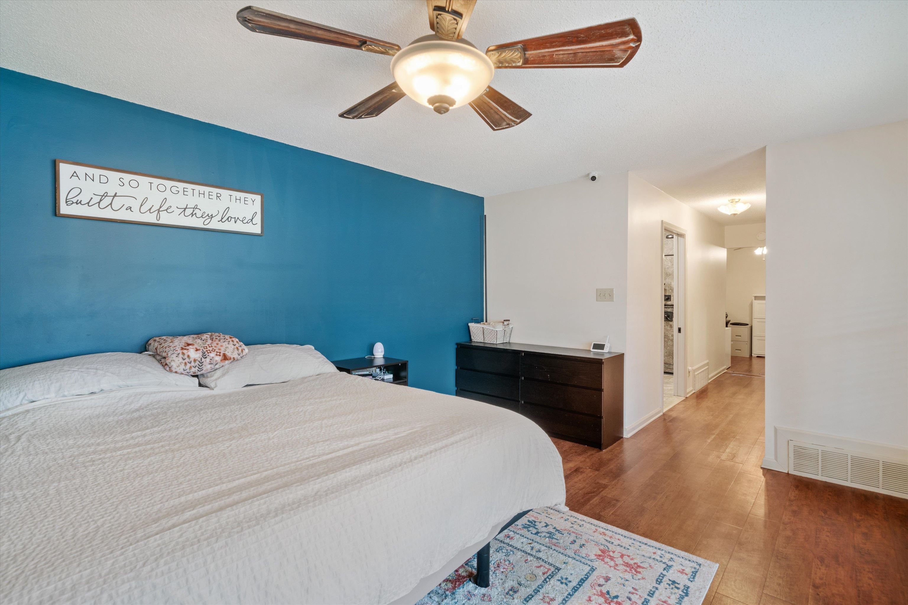 6463 Yale Road Bartlett, TN 38134 - Photo 13 of 29 a bedroom with a bed and a chandelier