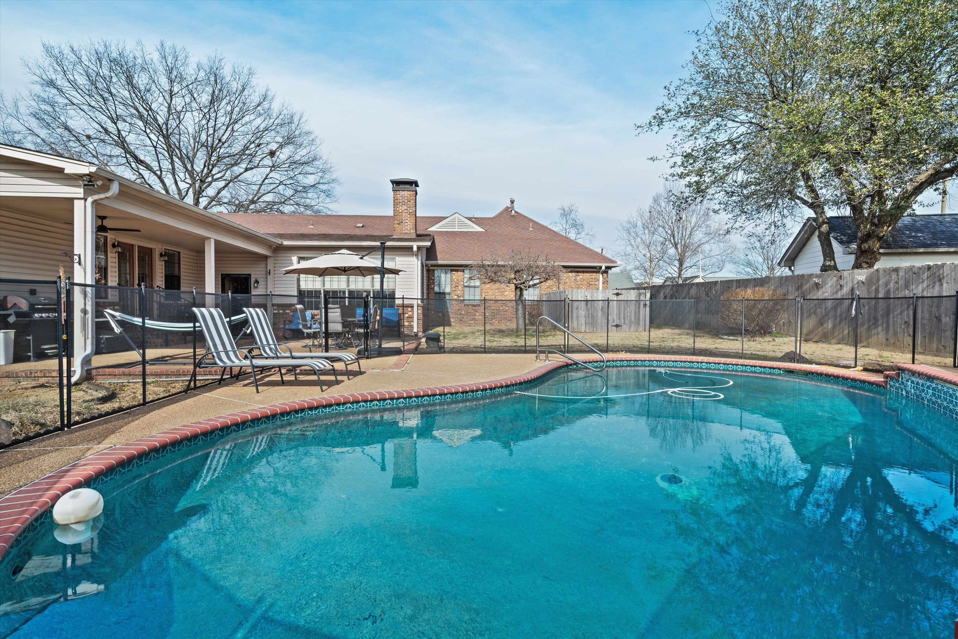 6463 Yale Road Bartlett, TN 38134 - Photo 2 of 29 a swimming pool view with a seating space and a garden view