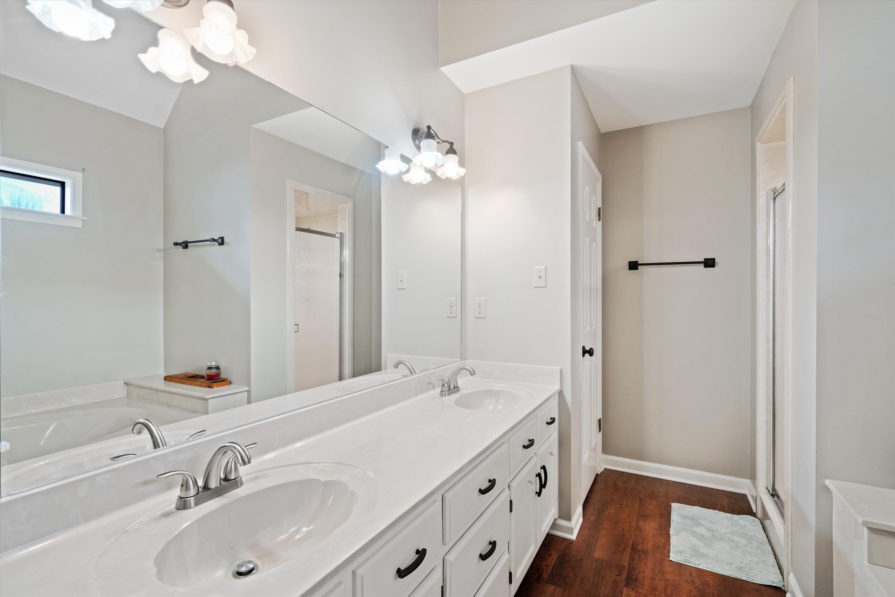 6463 Yale Road Bartlett, TN 38134 - Photo 23 of 29 a bathroom with a double vanity sink a mirror and a shower