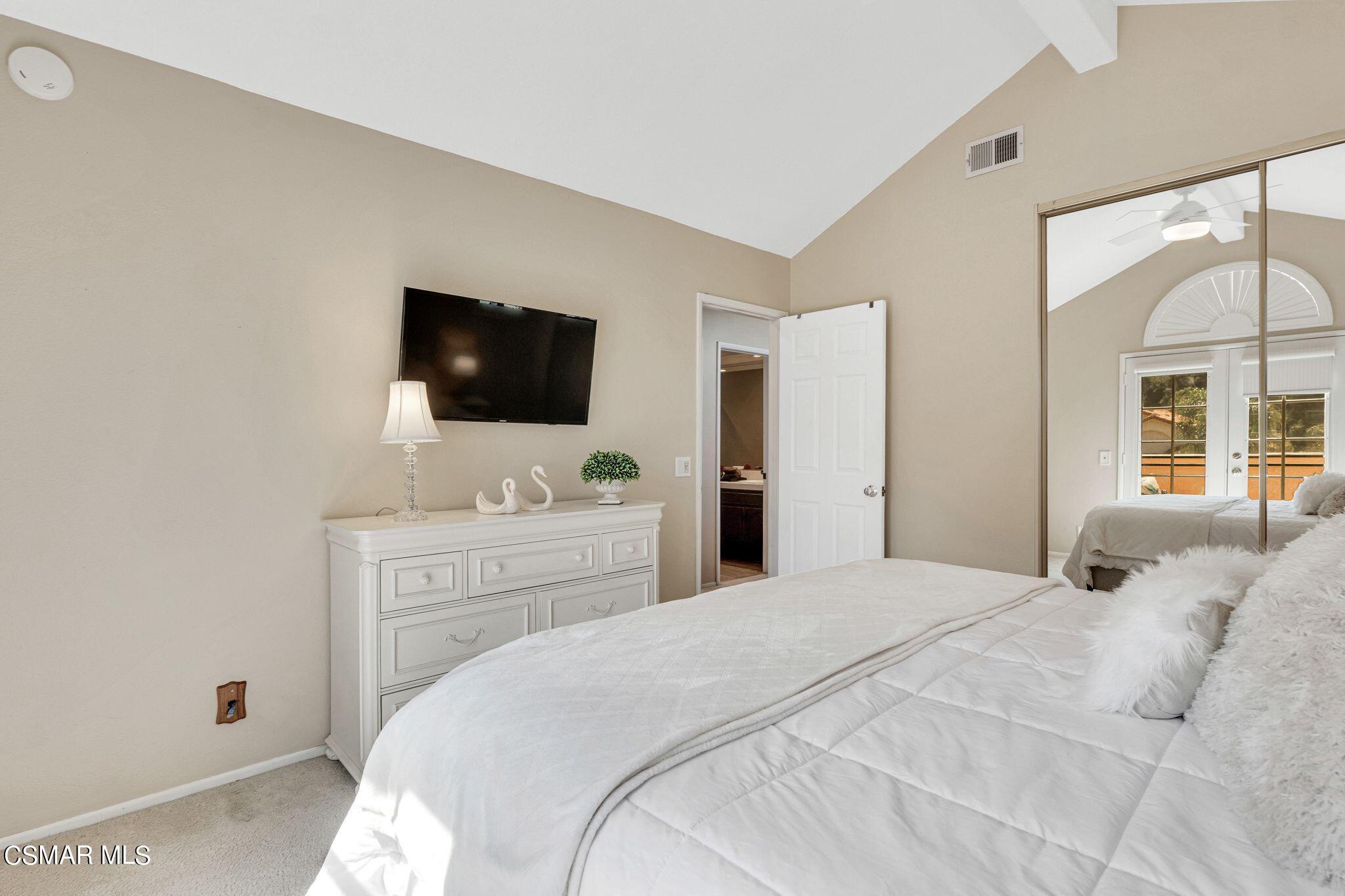 506 Innwood Road Simi Valley, CA 93065 - Photo 32 of 54 a bedroom with a bed and a flat screen tv