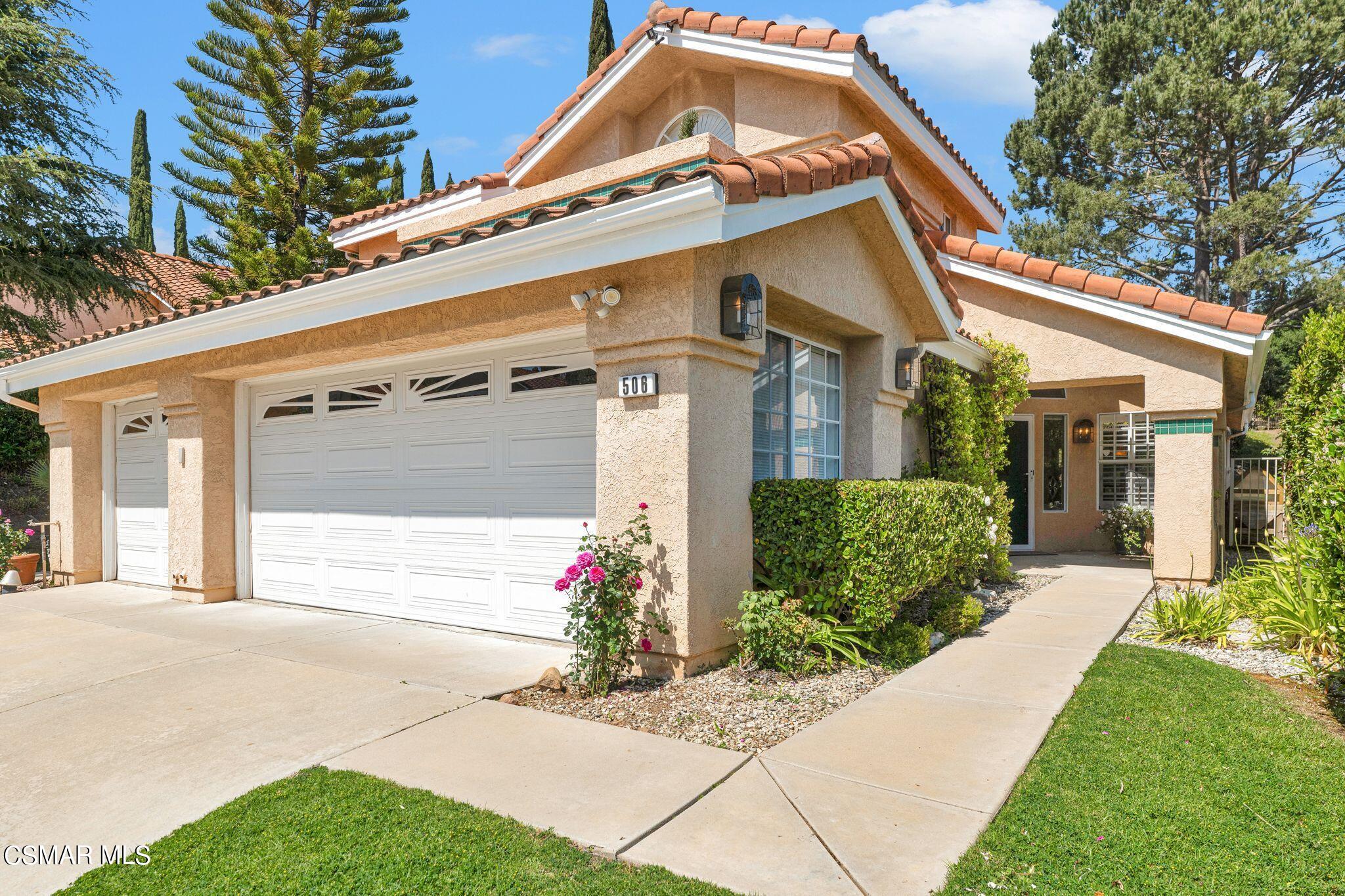 506 Innwood Road Simi Valley, CA 93065 - Photo 4 of 54 a front view of a house with a yard and outdoor seating