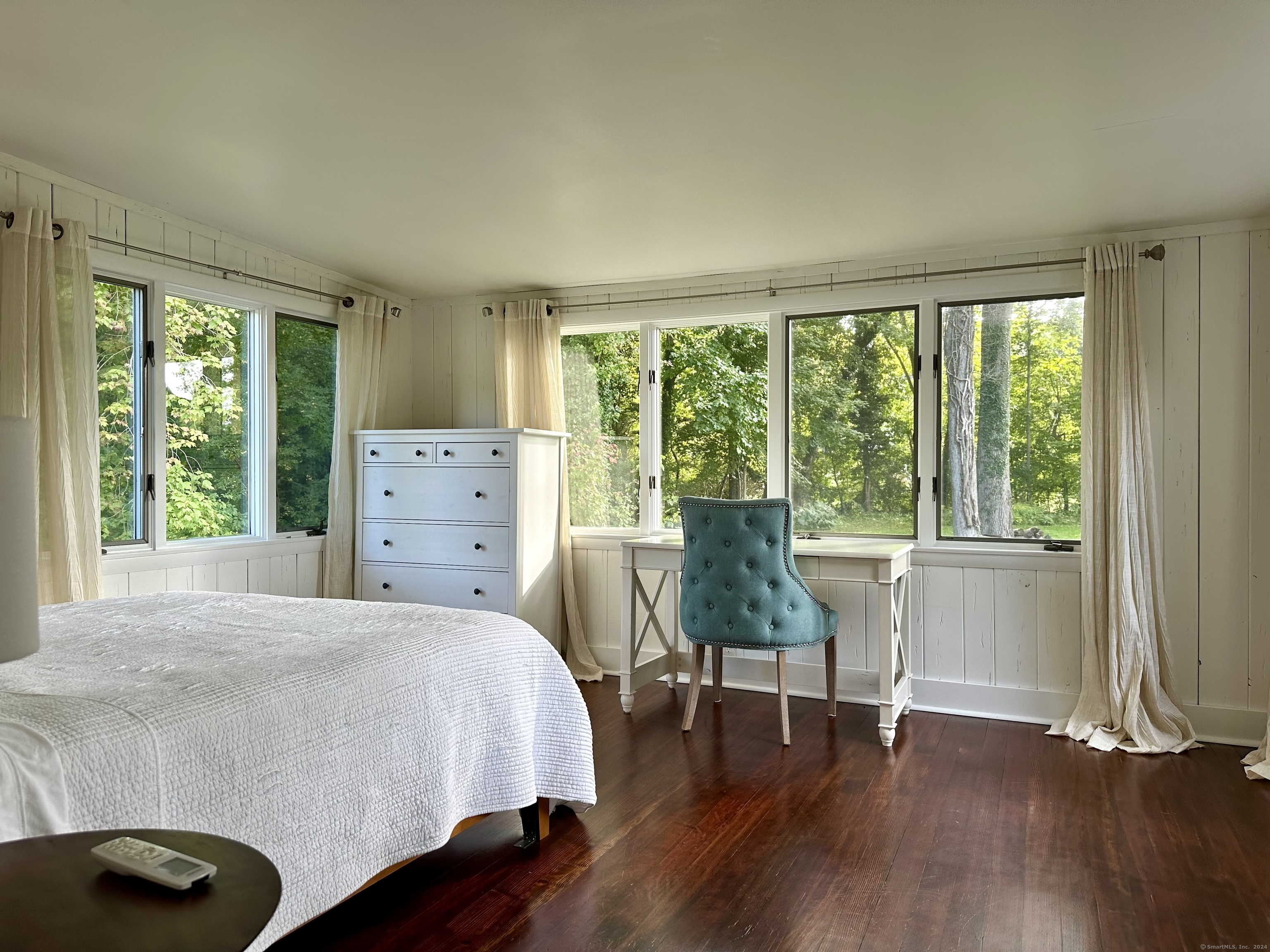 36 Tuxis Road Madison, CT 06443 - Photo 12 of 16 a bedroom with a bed and a chair