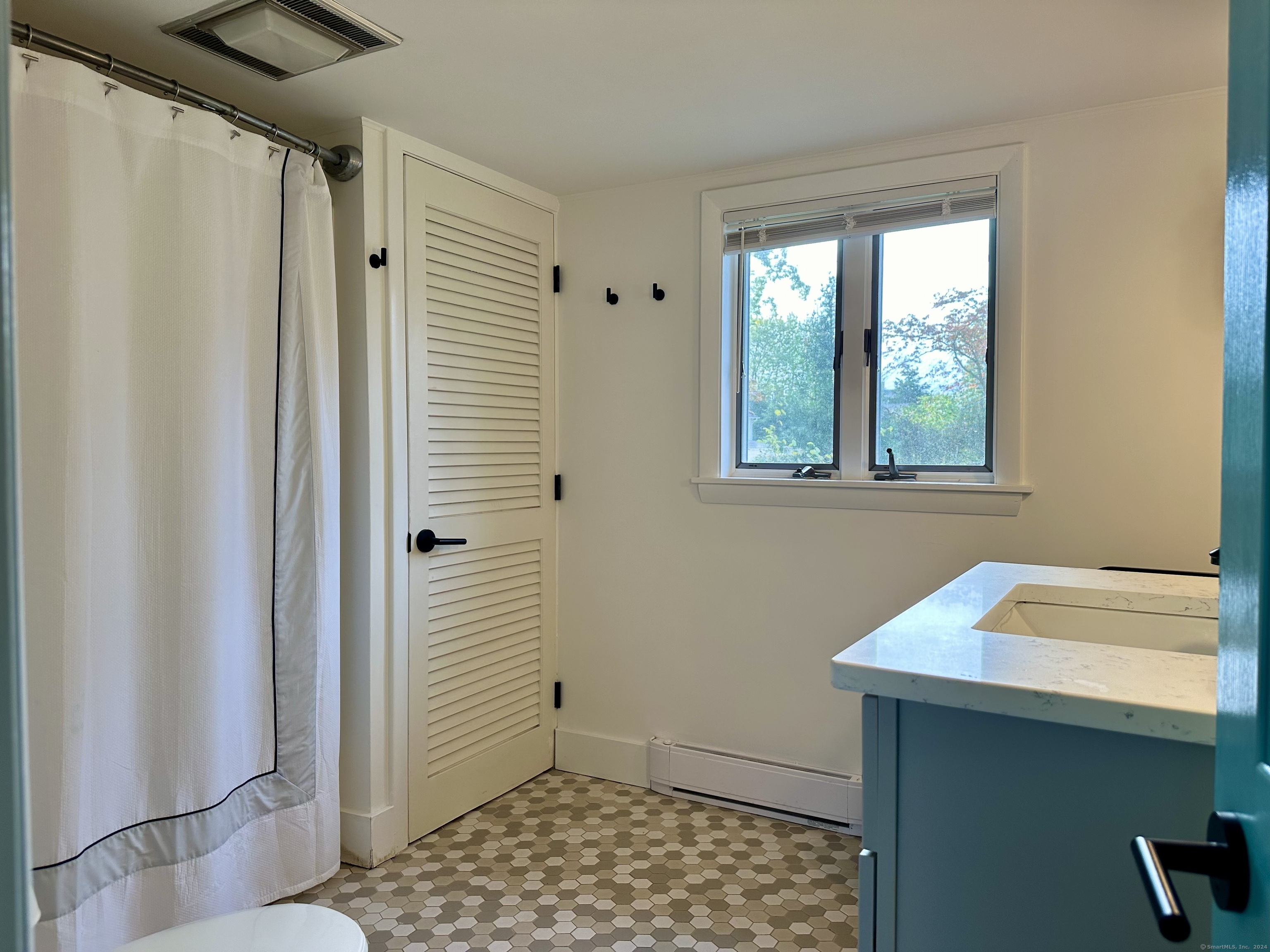36 Tuxis Road Madison, CT 06443 - Photo 14 of 16 a bathroom with a sink and a window