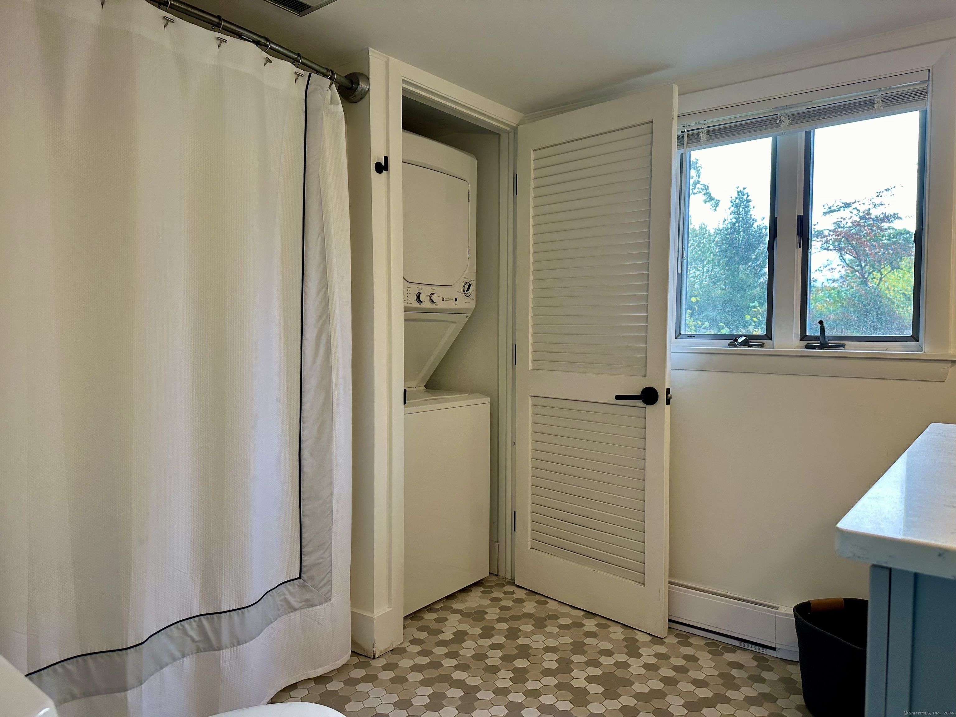 36 Tuxis Road Madison, CT 06443 - Photo 15 of 16 a bathroom with a sink and a mirror