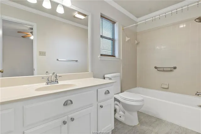 a bathroom with a sink a toilet and a bathtub