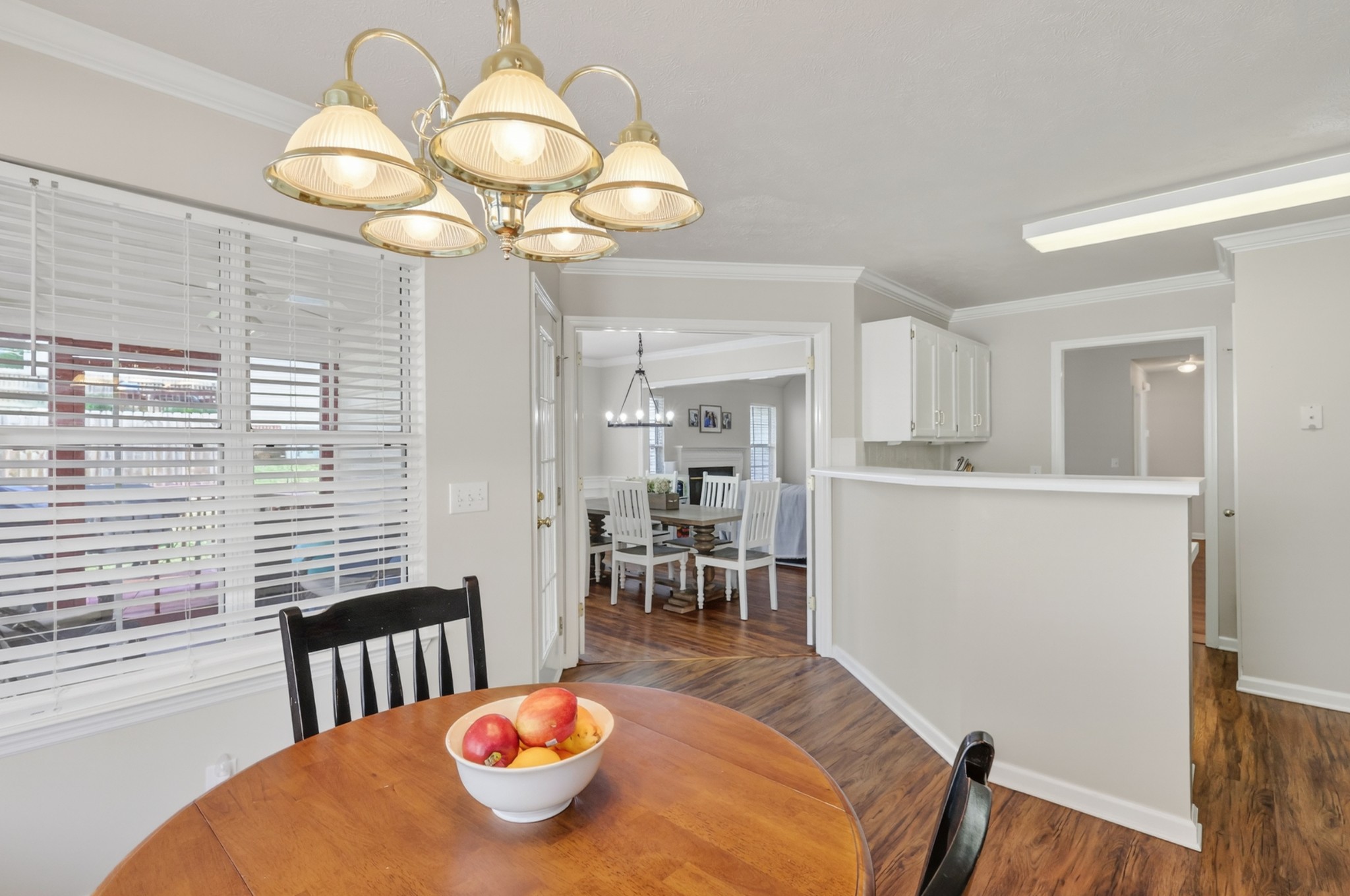 136 Holt Hills Road Nashville, TN 37211 - Photo 11 of 30 a view of a dining room with furniture wooden floor and chandelier