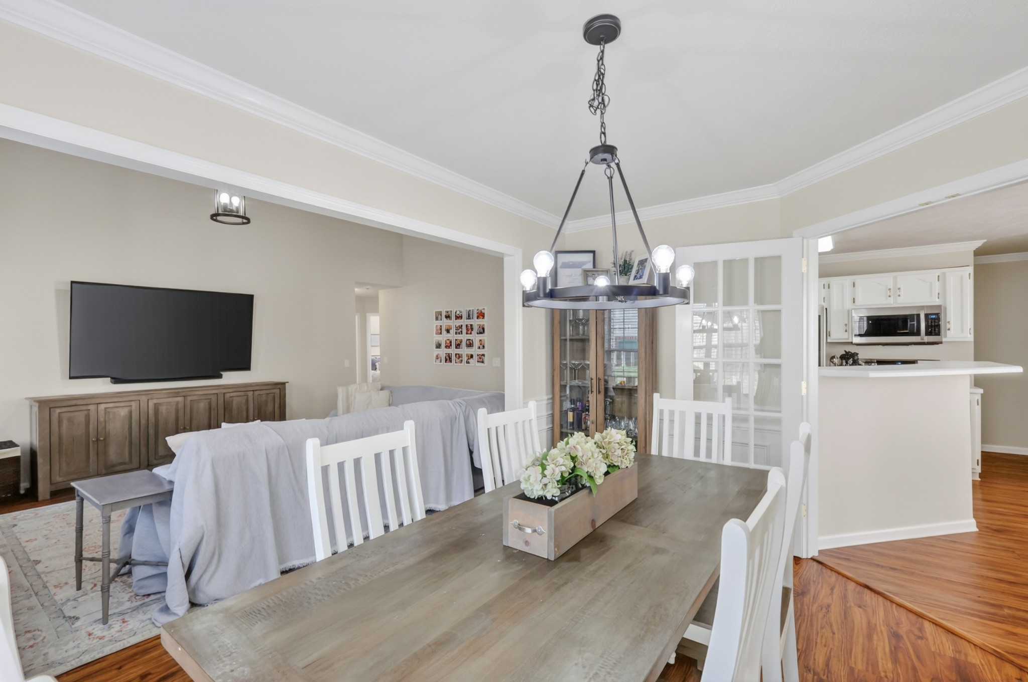 136 Holt Hills Road Nashville, TN 37211 - Photo 16 of 30 a view of a dining room and livingroom with furniture wooden floor a chandelier
