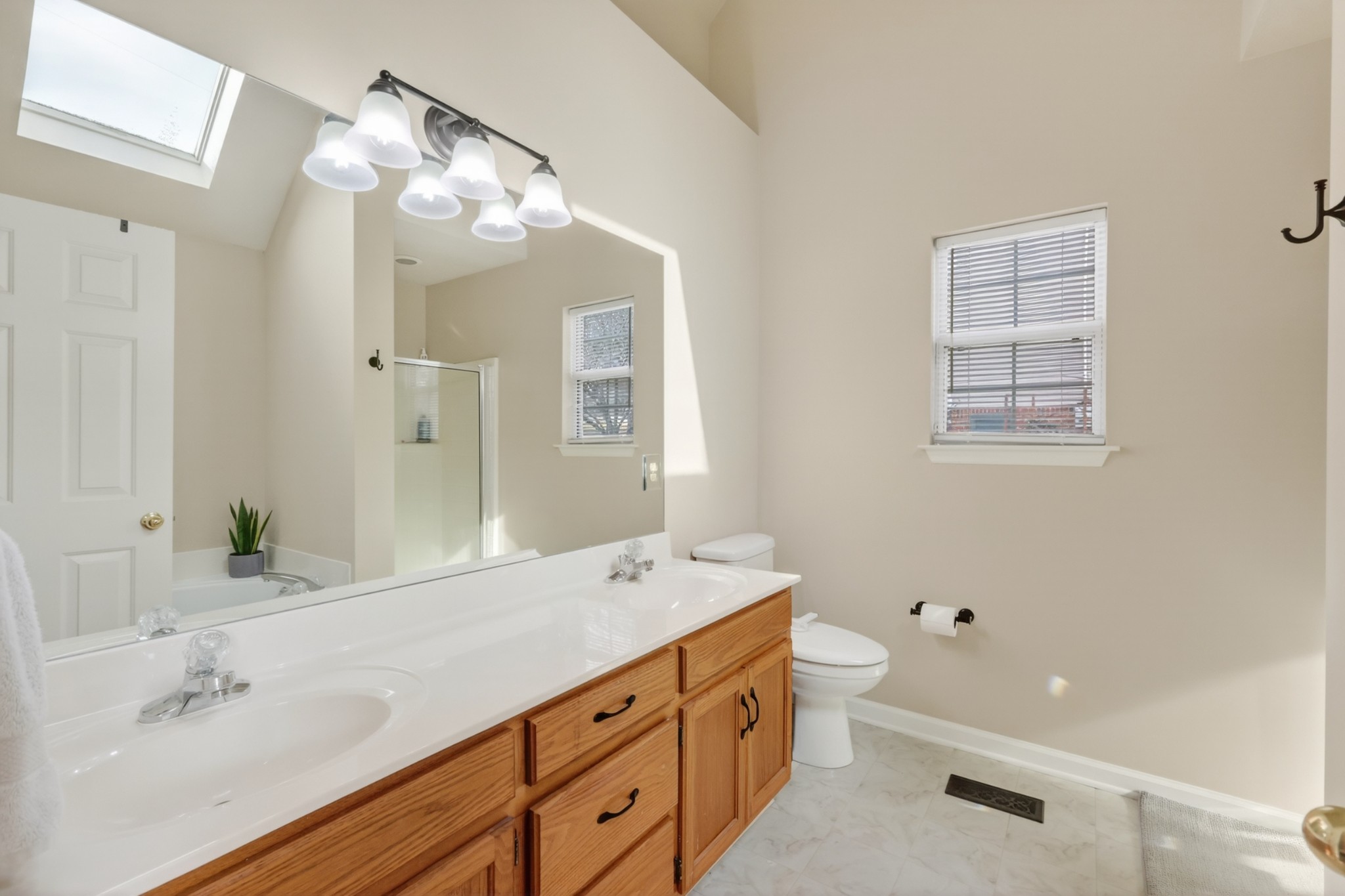 136 Holt Hills Road Nashville, TN 37211 - Photo 19 of 30 a bathroom with a double vanity sink mirror and double