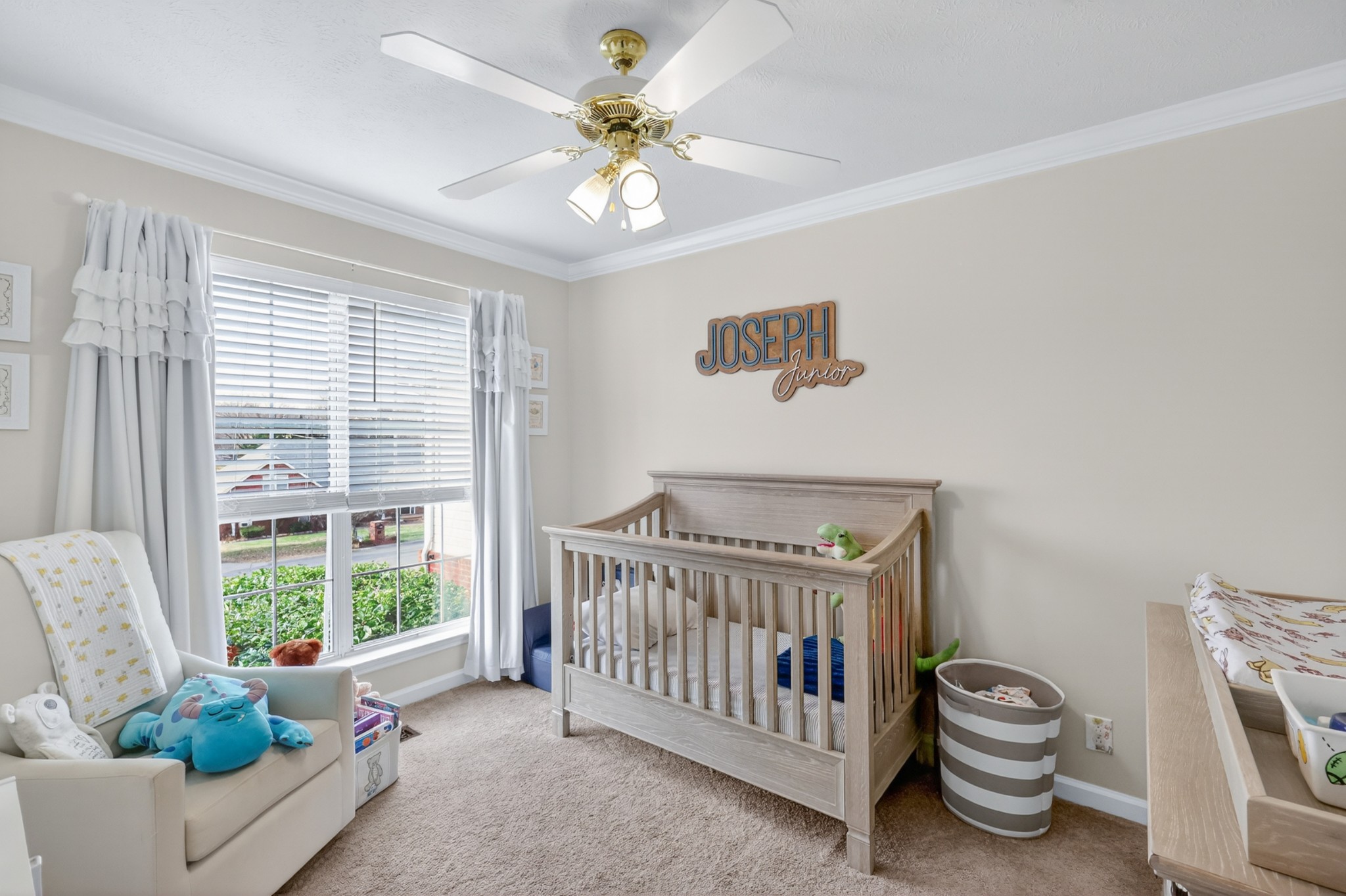 136 Holt Hills Road Nashville, TN 37211 - Photo 24 of 30 a bedroom with a bed and a chandelier