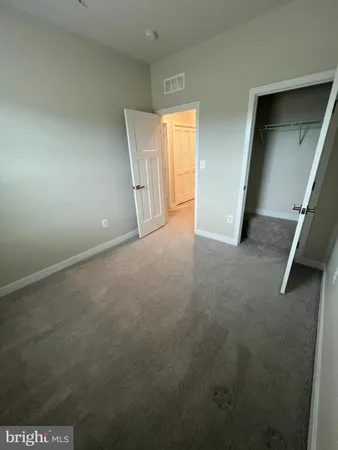 a bathroom with a bathtub and a window