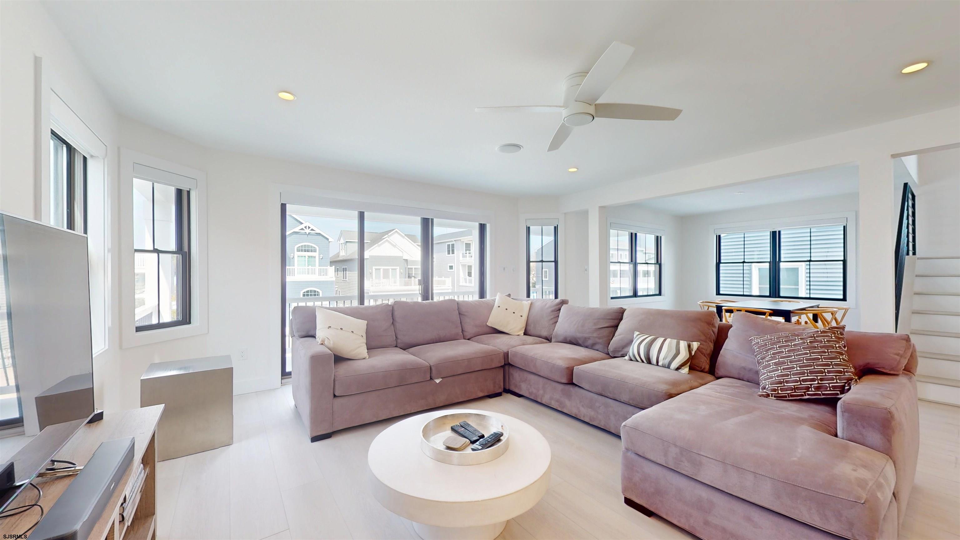 342 38th Street South Brigantine, NJ 08203 - Photo 11 of 86 a living room with furniture and a large window