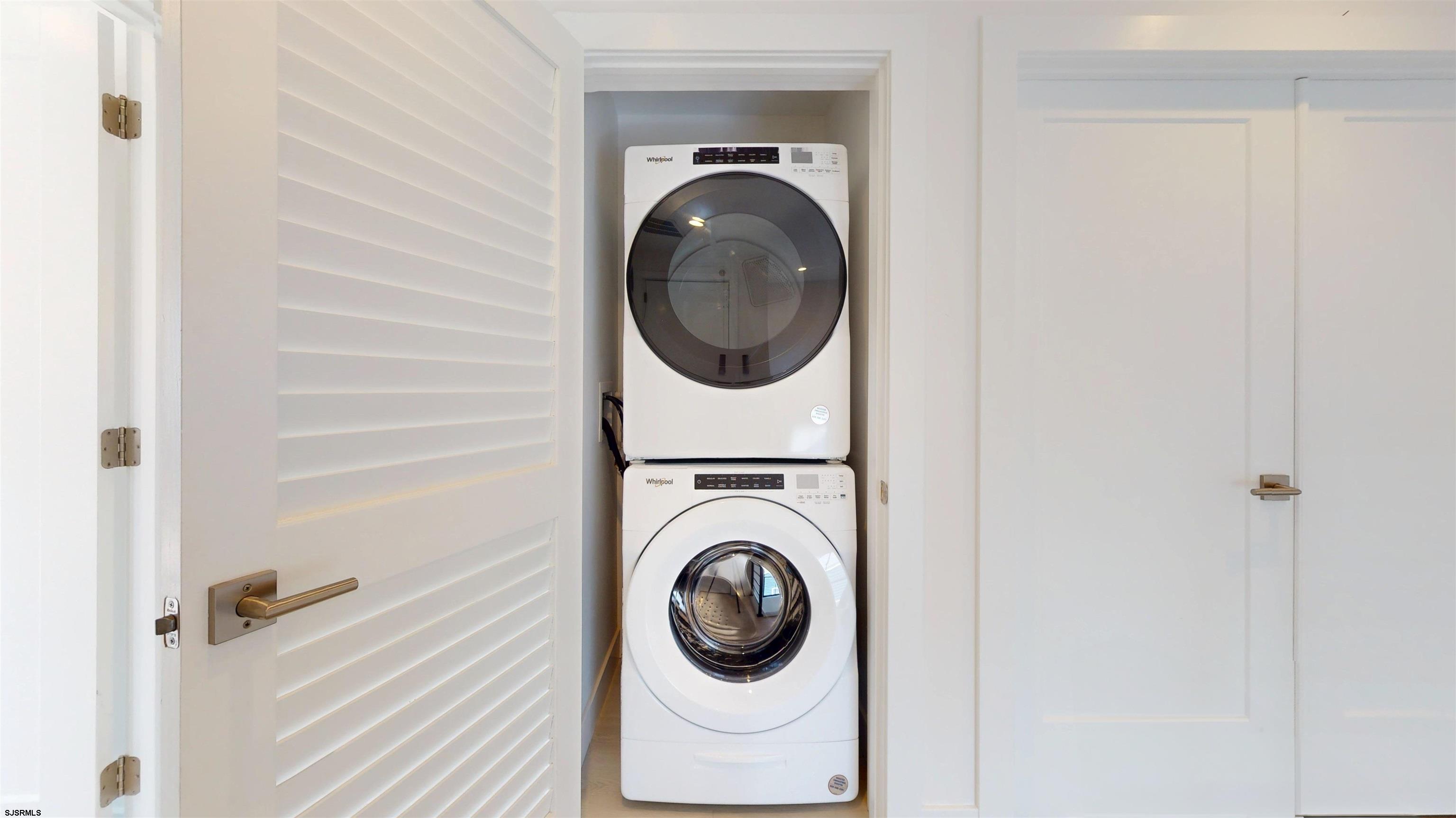 342 38th Street South Brigantine, NJ 08203 - Photo 14 of 86 a close view of a utility room with dryer and washer