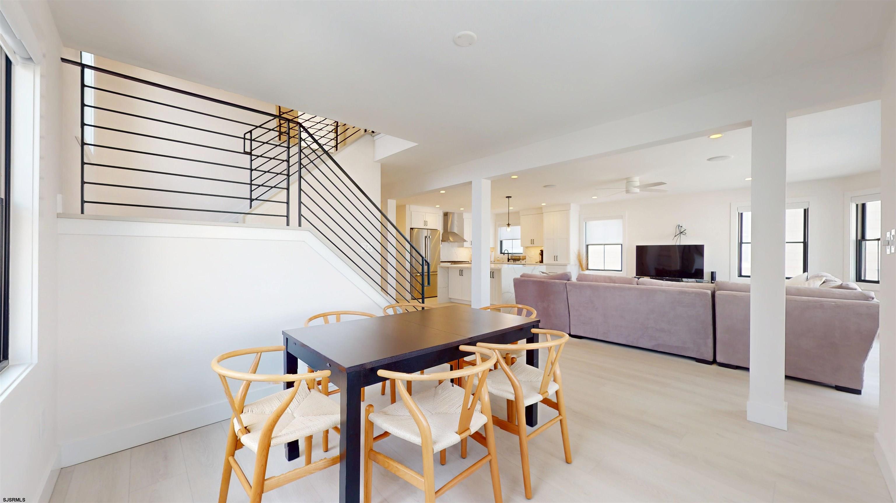 342 38th Street South Brigantine, NJ 08203 - Photo 35 of 86 a living room with furniture and a flat screen tv