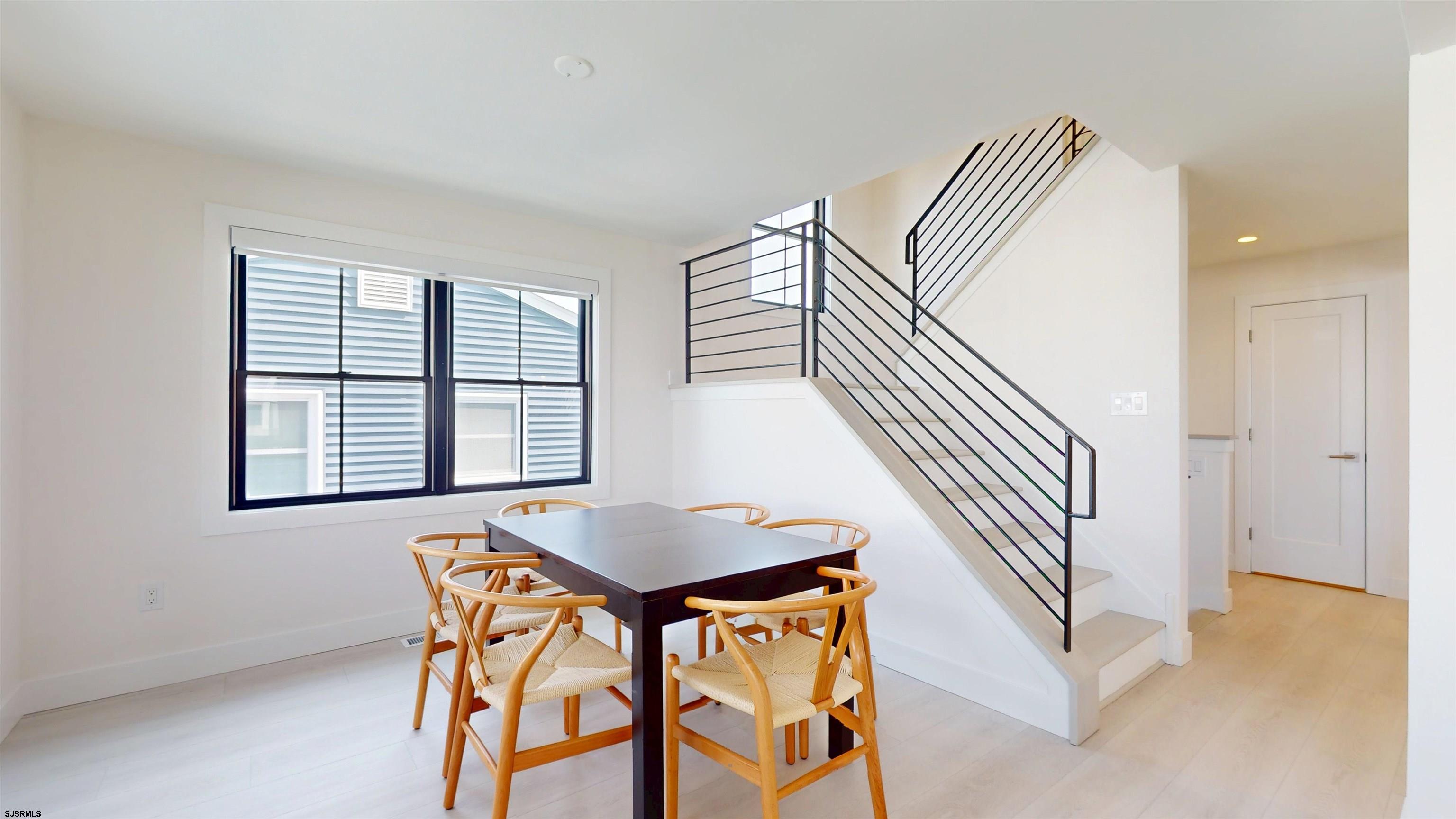 342 38th Street South Brigantine, NJ 08203 - Photo 36 of 86 a view of a livingroom with furniture and staircase