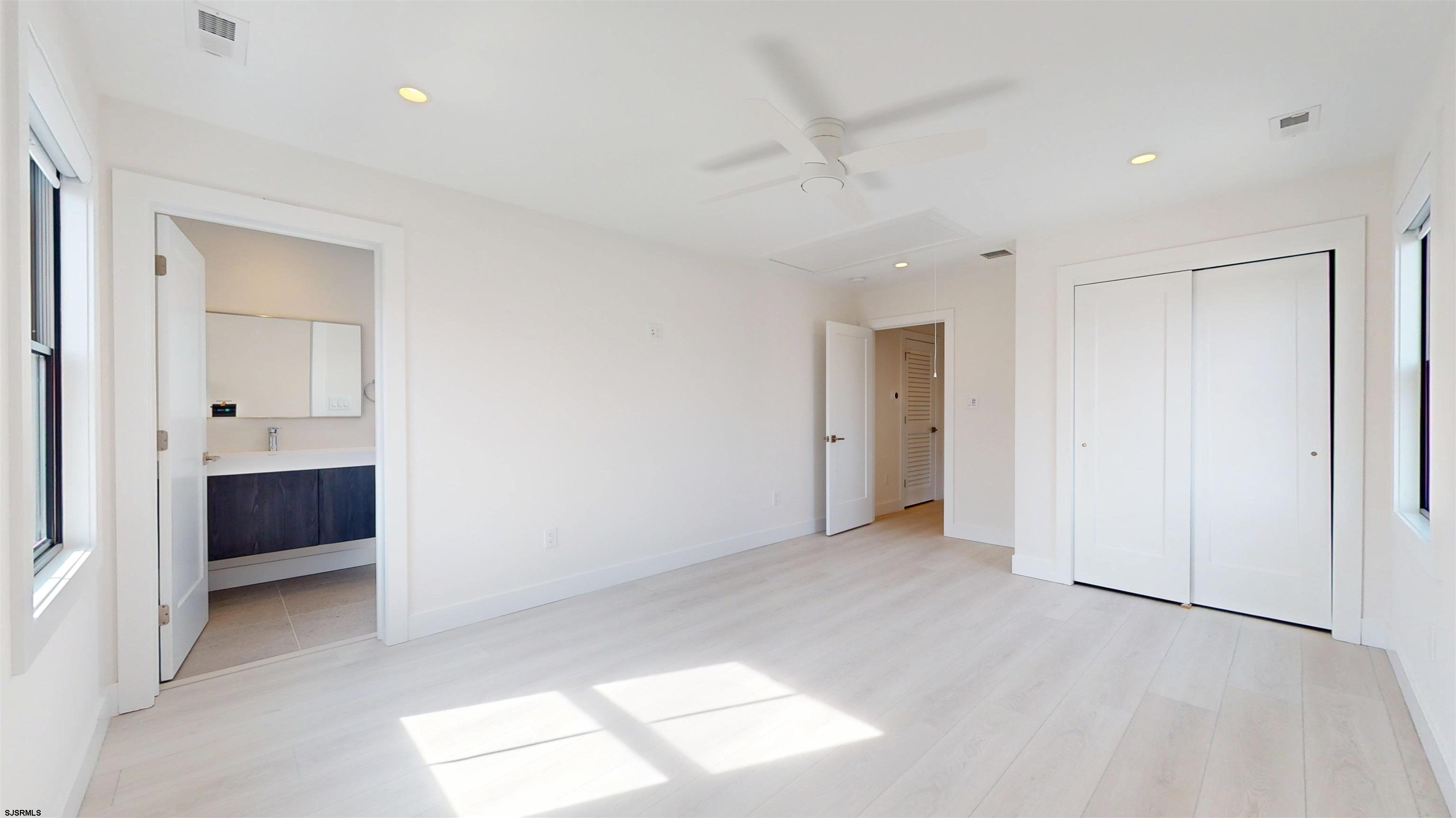 342 38th Street South Brigantine, NJ 08203 - Photo 42 of 86 a view of an empty room with a window