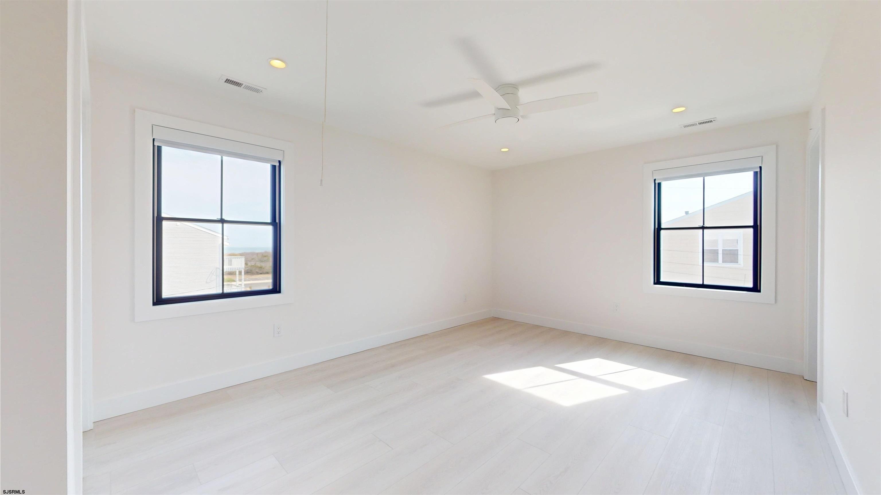 342 38th Street South Brigantine, NJ 08203 - Photo 44 of 86 an empty room with windows and fan