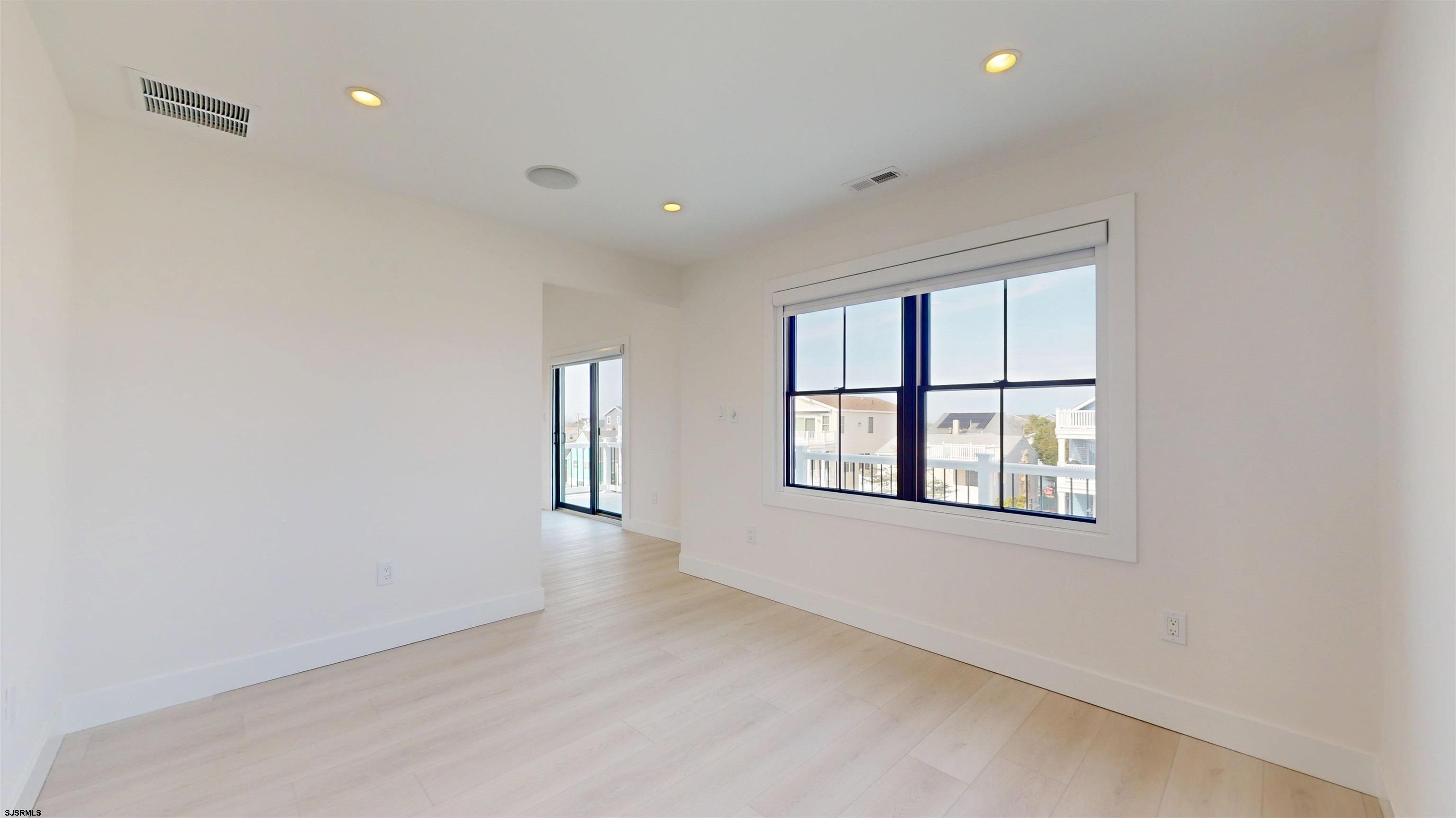 342 38th Street South Brigantine, NJ 08203 - Photo 46 of 86 an empty room with a window