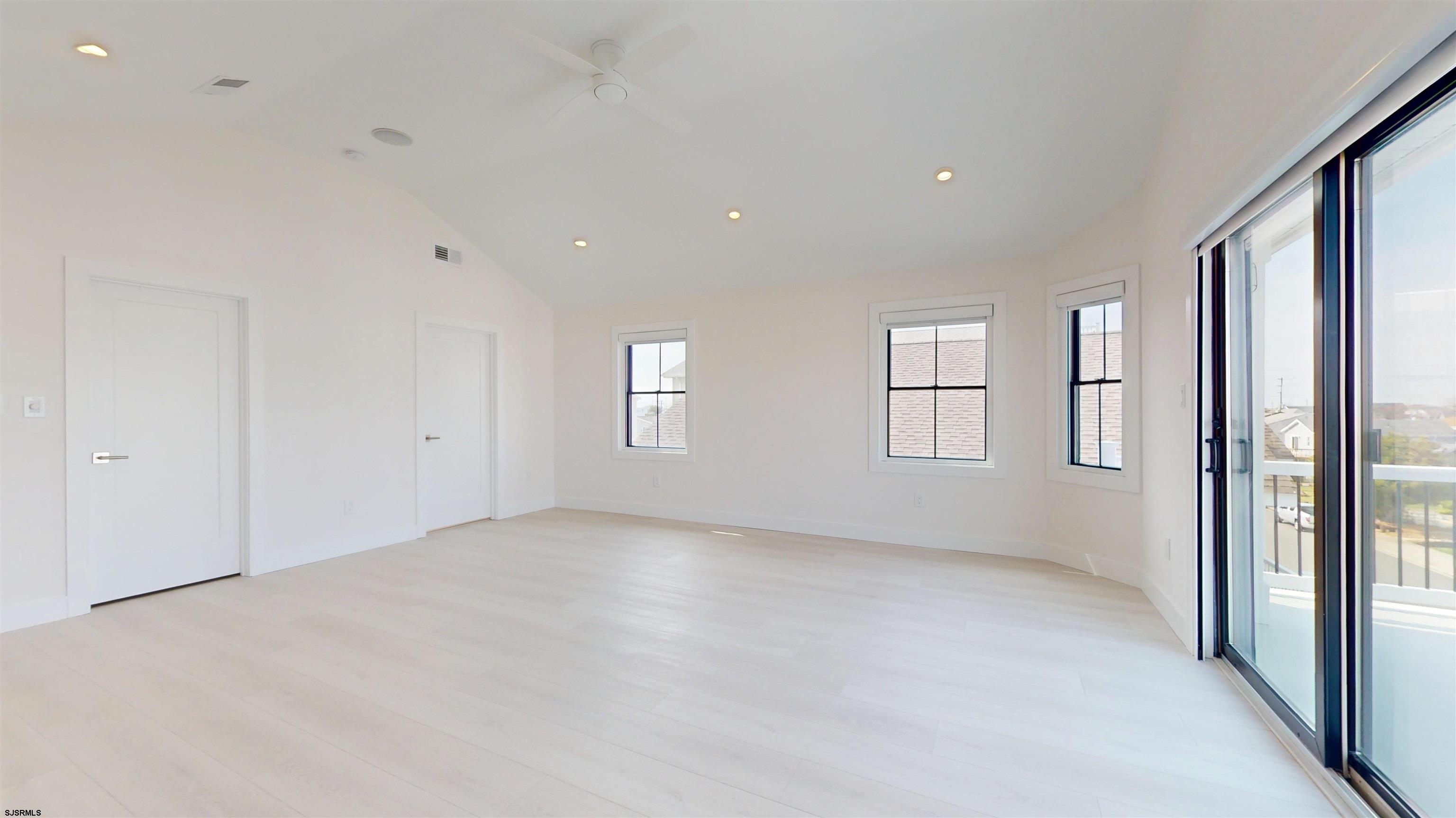 342 38th Street South Brigantine, NJ 08203 - Photo 49 of 86 a view of an empty room with a window